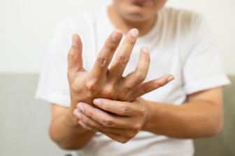 A man with shaking hands from delirium tremens