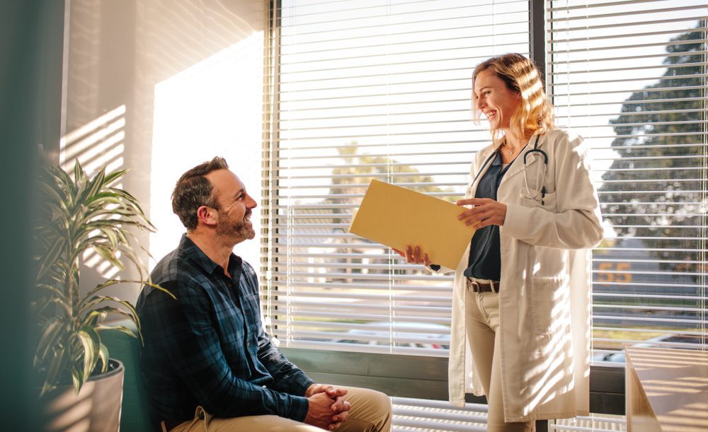 Doctor advising a man in rehab 