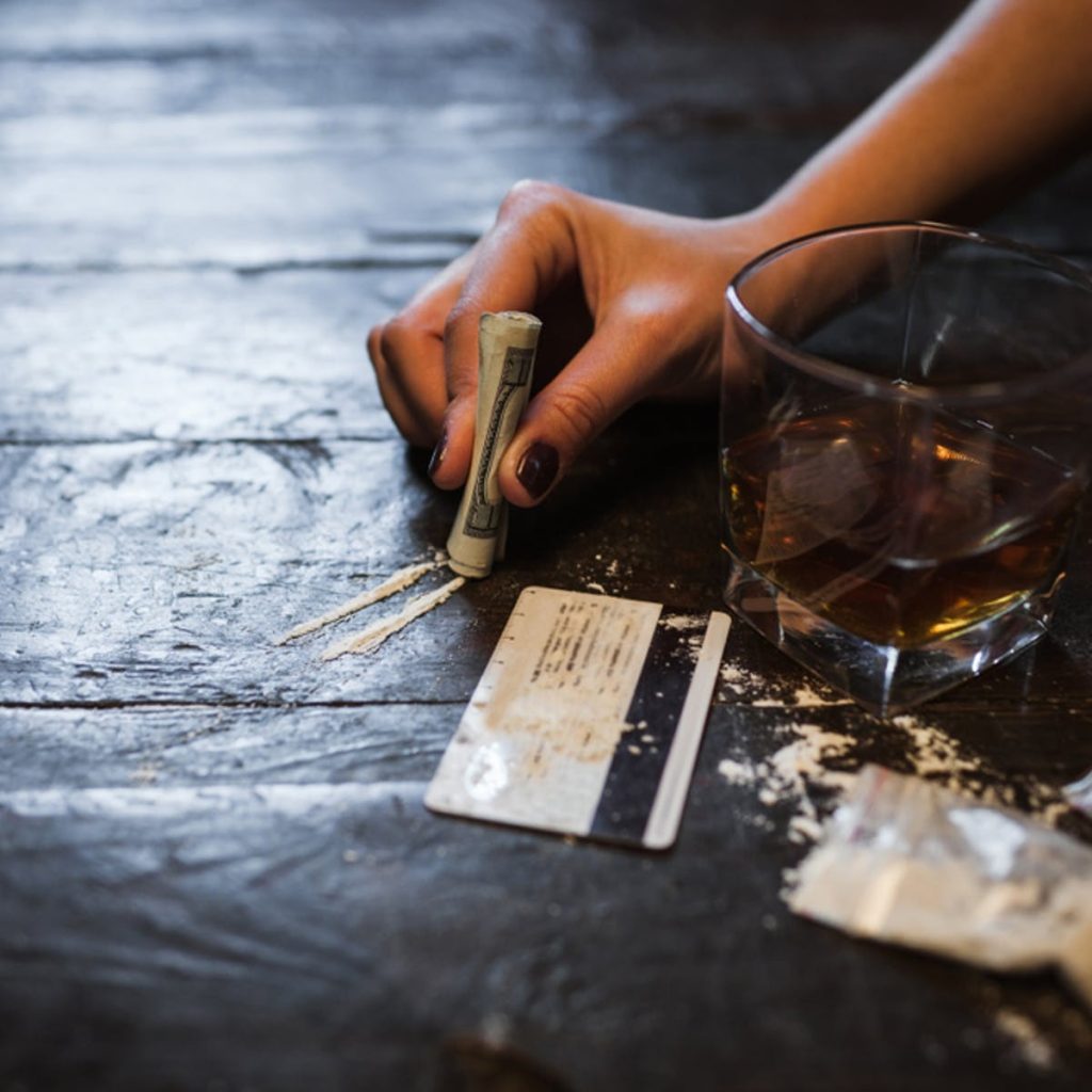 Image showing alcohol and drugs, illustrating addiction risks.