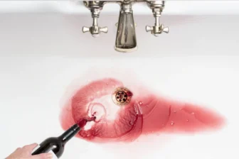 Spilled wine in sink symbolizing alcohol detox and recovery
