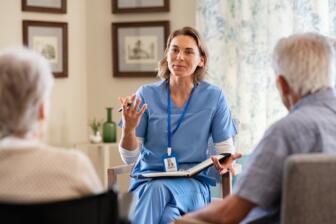 Counselor leading group therapy for alcohol recovery support
