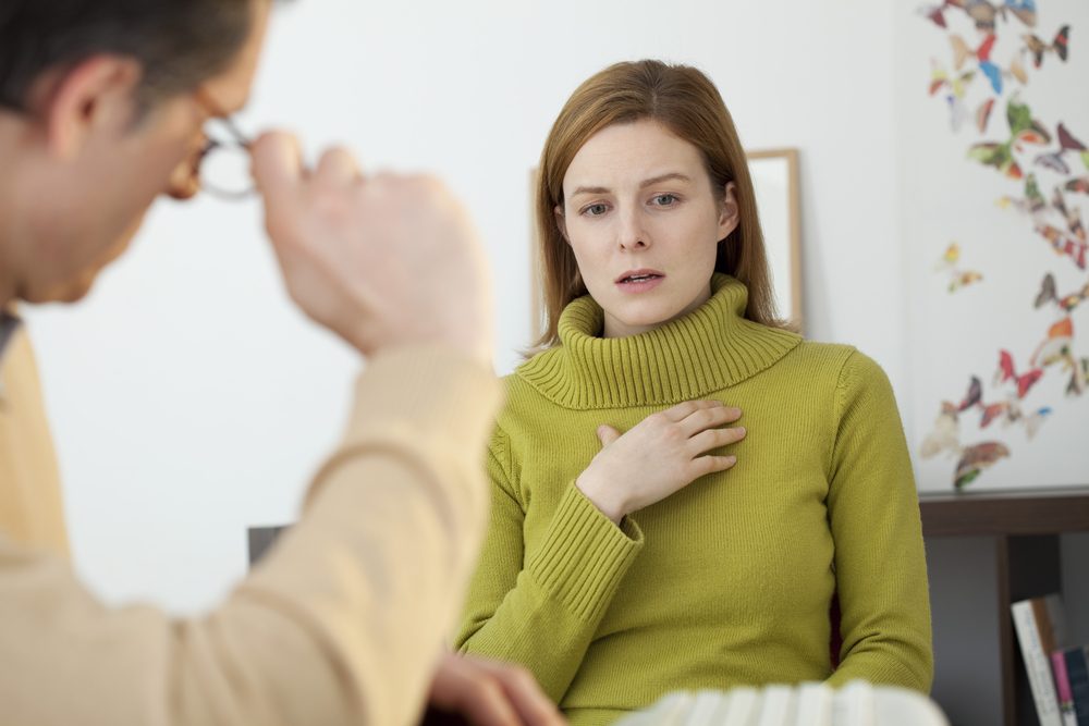 Woman speaking with counselor during alcohol recovery