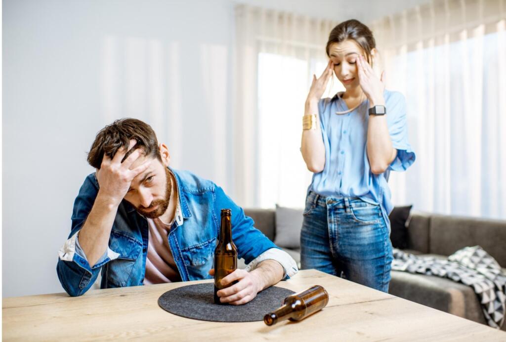 Couple discussing alcohol recovery, seeking rehab support
