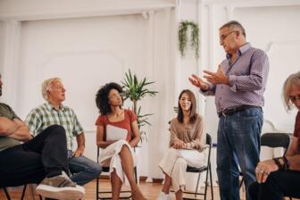 Support group meeting for alcohol rehab Cuddington discussing recovery