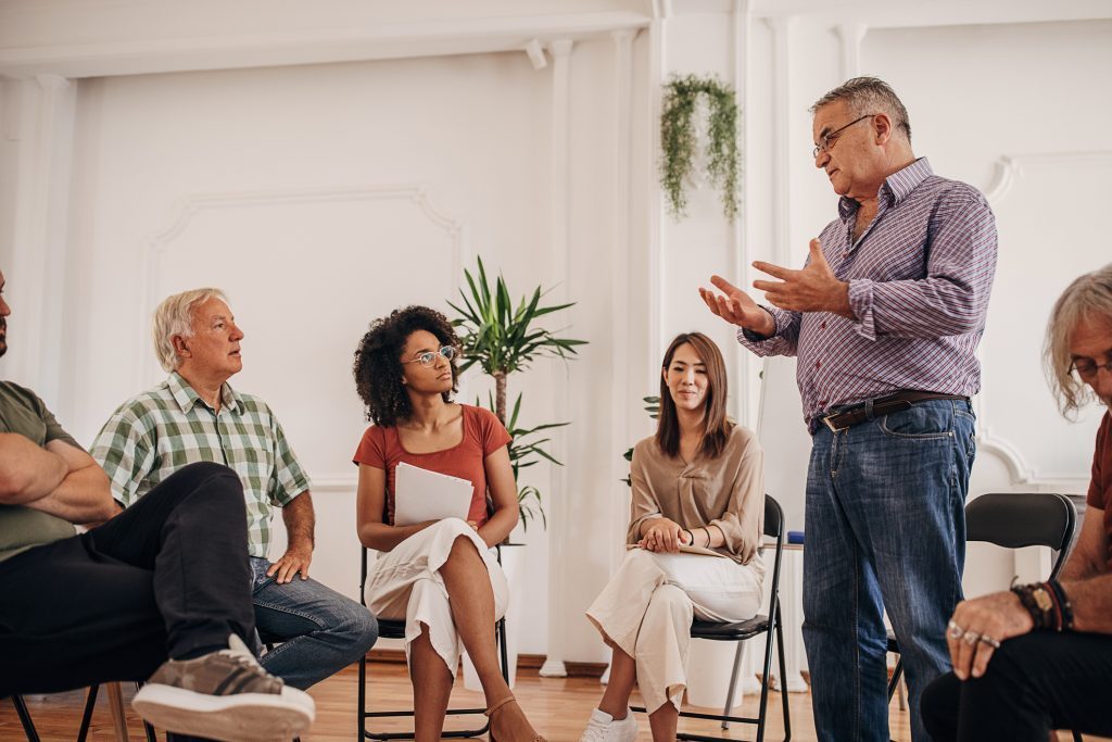 Support group meeting for alcohol rehab Cuddington discussing recovery