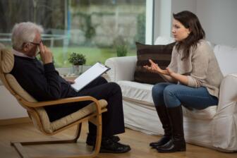 A therapist and patient in an alcohol rehab session in Eastbourne.