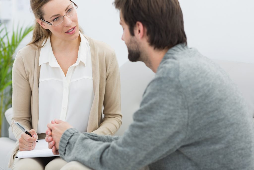 Counselor and patient discussing alcohol rehab Glasgow program