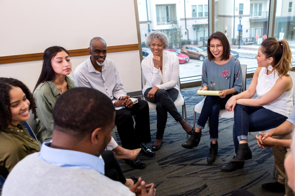 Group of diverse people in a counseling session at alcohol rehab Malvern