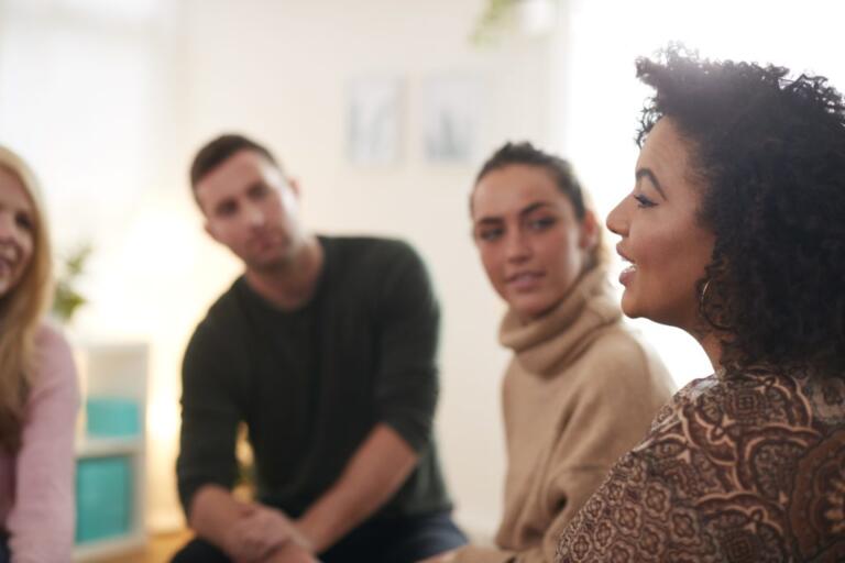 Group therapy session for alcohol rehab Northwich, participants sharing experiences.