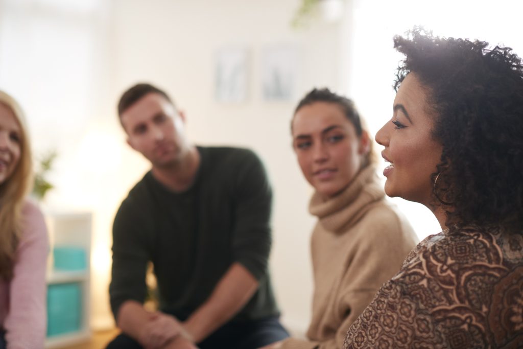 Group therapy session for alcohol rehab Northwich, participants sharing experiences.