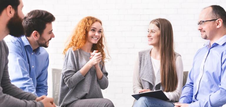 People in group therapy discussing alcohol rehab in South East England