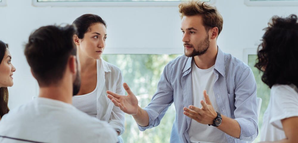 Attendees in an Alcohol Rehab West Midlands support group meeting.