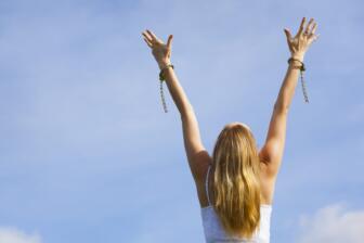 Woman breaking free from chains symbolizing cycle of addiction