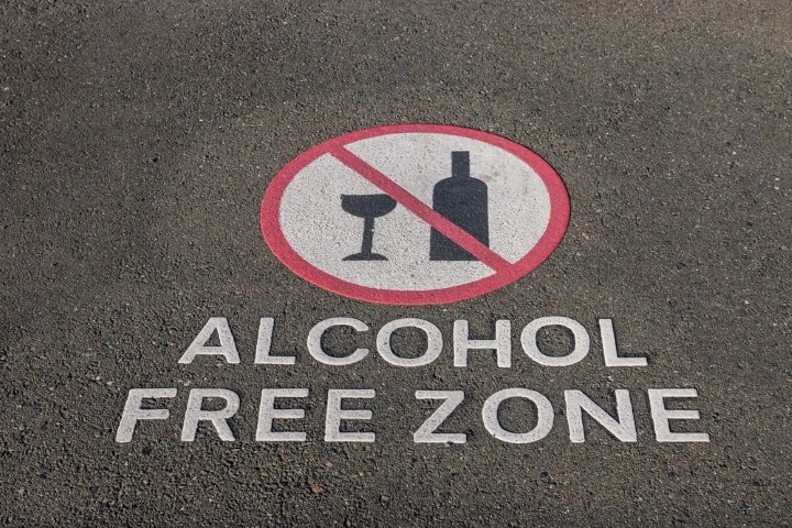 "Alcohol Free Zone" sign depicts a no-alcohol policy, emphasizing recovery.