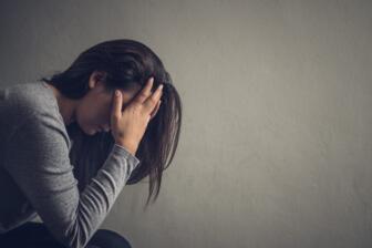 Woman experiencing comedown symptoms after quitting alcohol