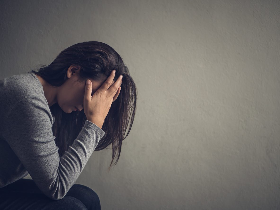 Woman experiencing comedown symptoms after quitting alcohol