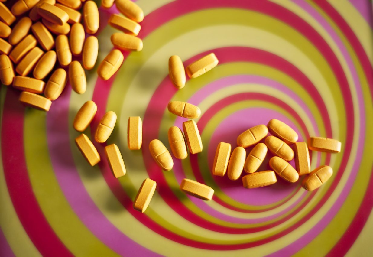 Image of pills illustrating comedown symptoms and detox effects