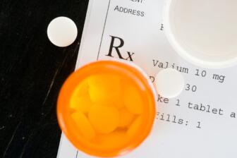 Prescription label with pills highlighting diazepam addiction concerns