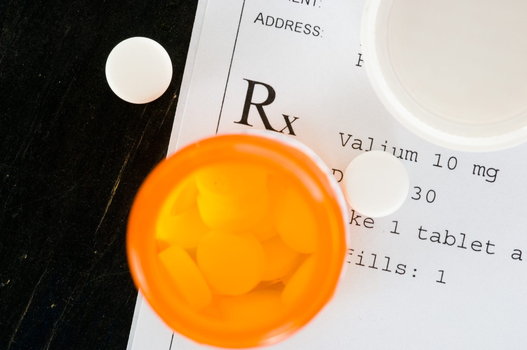 Prescription label with pills highlighting diazepam addiction concerns