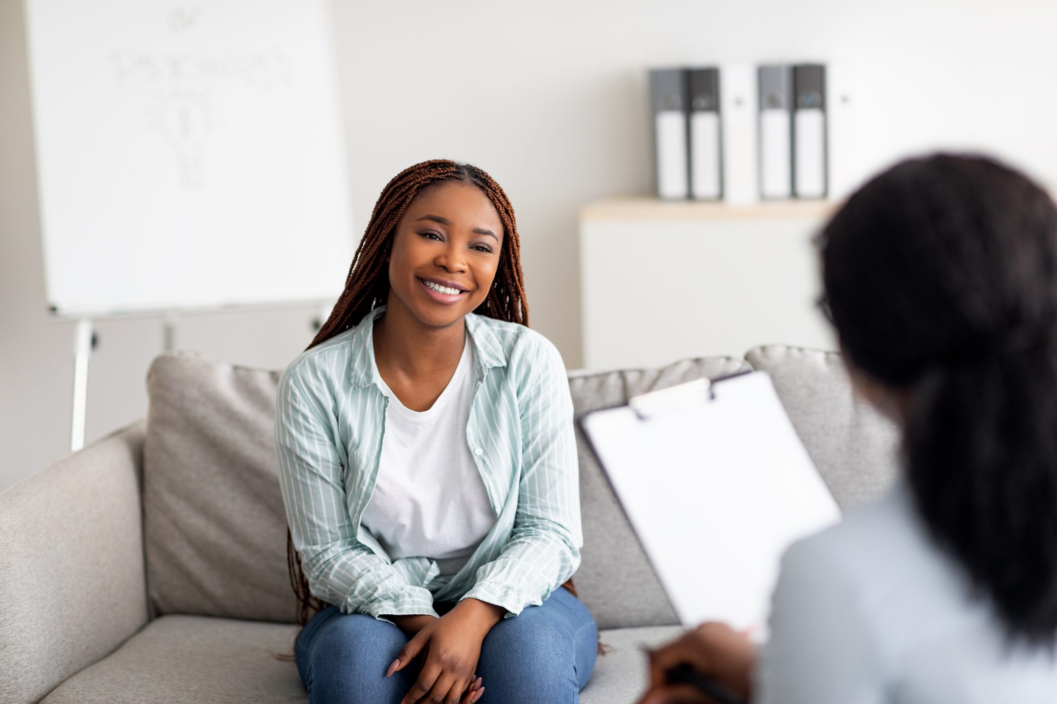 Woman discussing Disulfiram benefits for alcohol recovery with a therapist