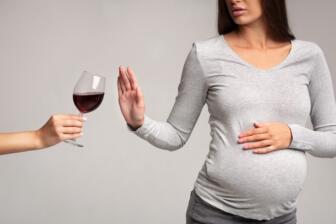 Pregnant woman refusing wine to prevent foetal alcohol syndrome