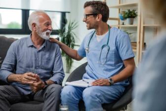 Doctor comforts man seeking alcohol rehab advice