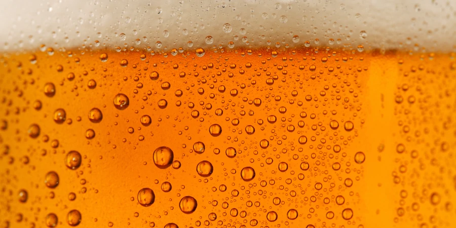 Close-up of beer bubbles illustrating the functioning alcoholic challenge.