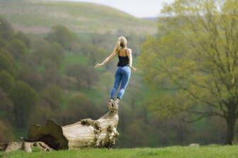 Woman embracing nature for holistic therapy in alcohol recovery