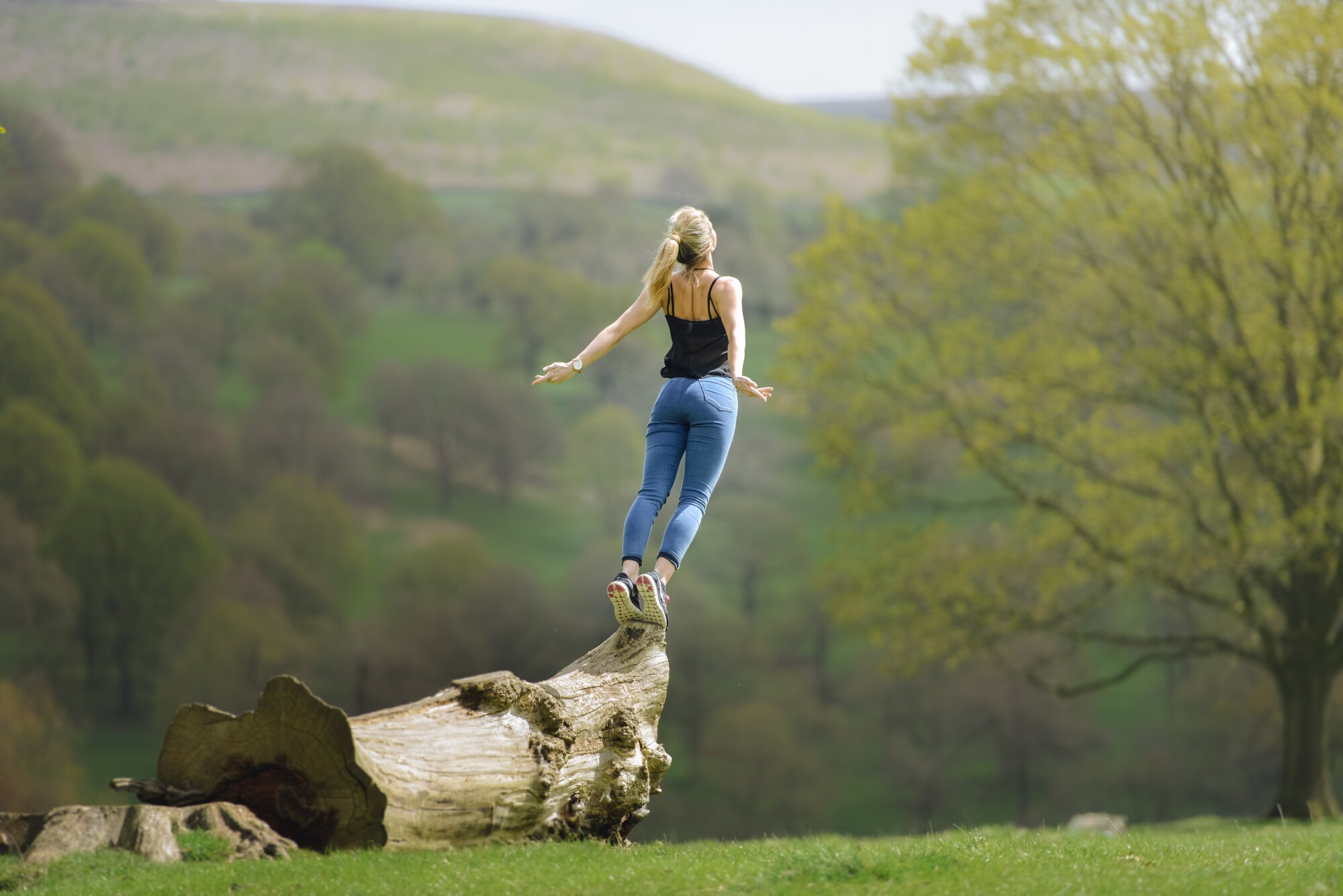 Woman embracing nature for holistic therapy in alcohol recovery