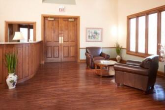 Comfortable seating areas and bedroom in a rehab center
