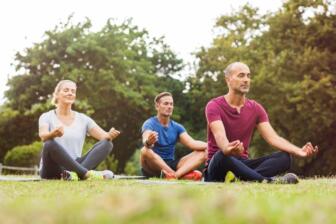 Group meditating outdoors at alcohol rehab Thetford program