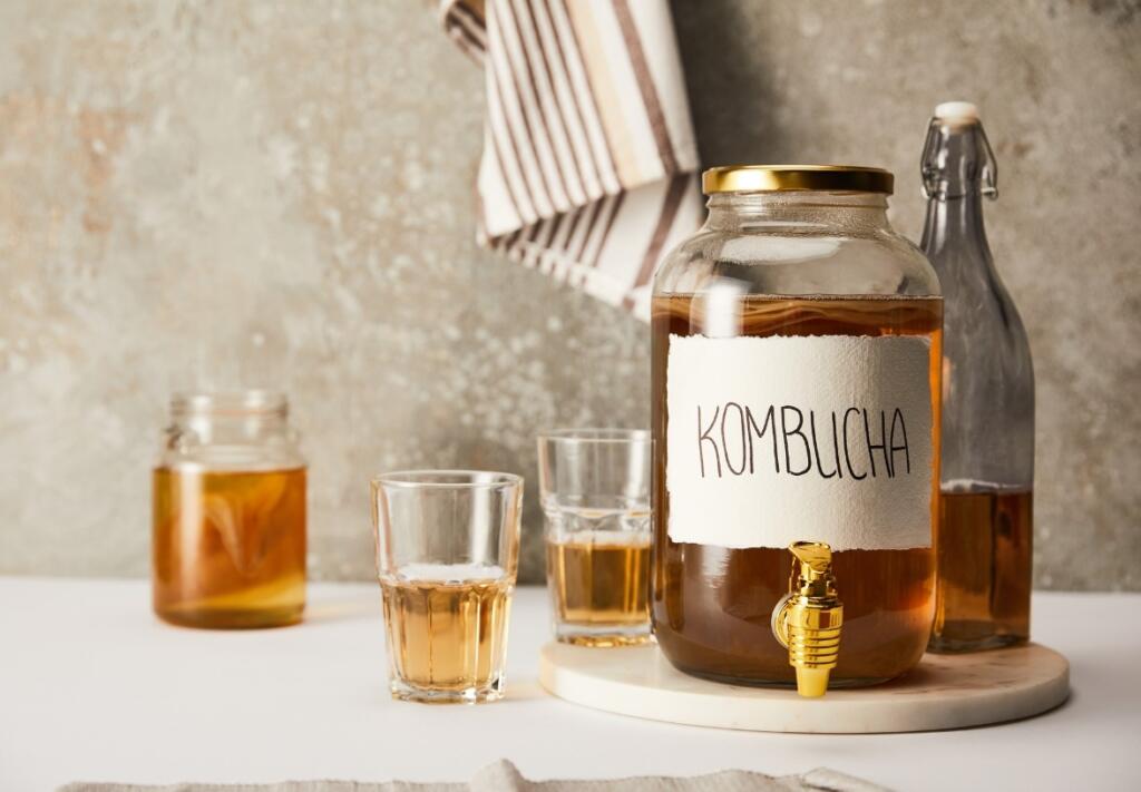 Kombucha with drinking glasses, a non alcoholic beer option for recovery