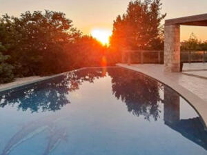 Serene sunset by a pool at rehab Cyprus, ideal for alcohol recovery