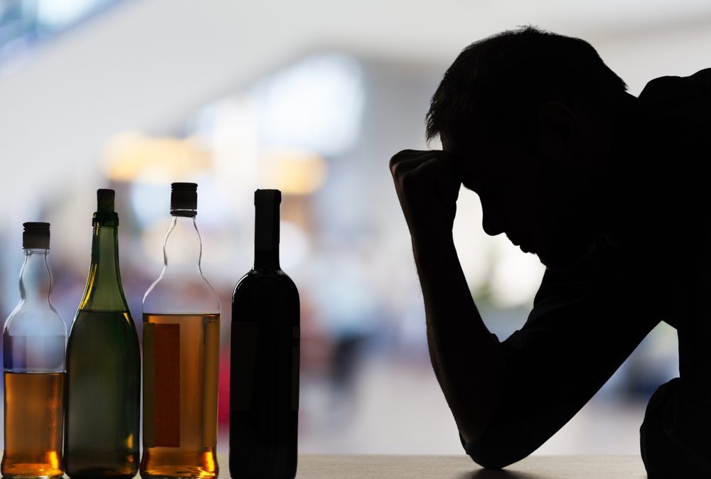 Silhouette of man struggling with alcohol, rehab Dubai support