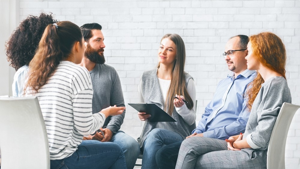 Support group in rehab Edinburgh discussing alcohol recovery strategies