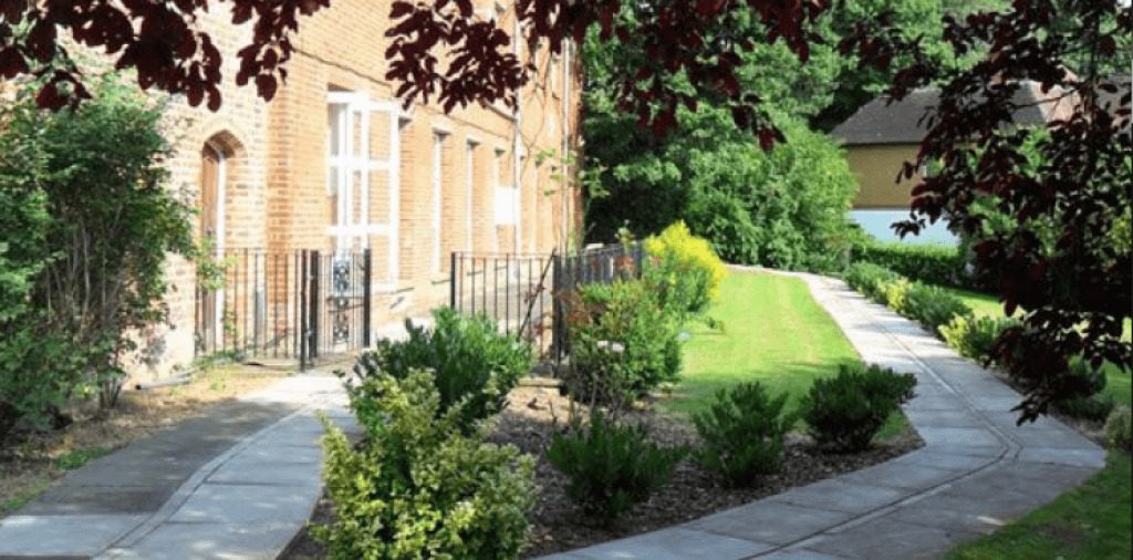 Pathway through garden at rehab center for alcohol addiction support