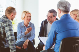 Group therapy session in rehab Rochester for alcohol addiction support