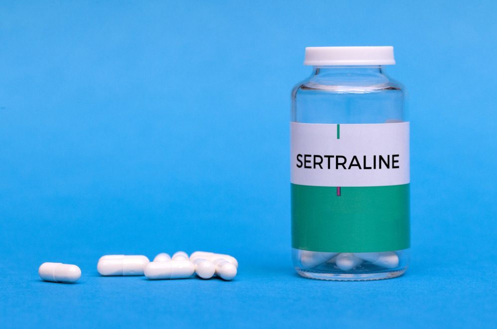 Sertraline bottle and capsules for mental health support in recovery