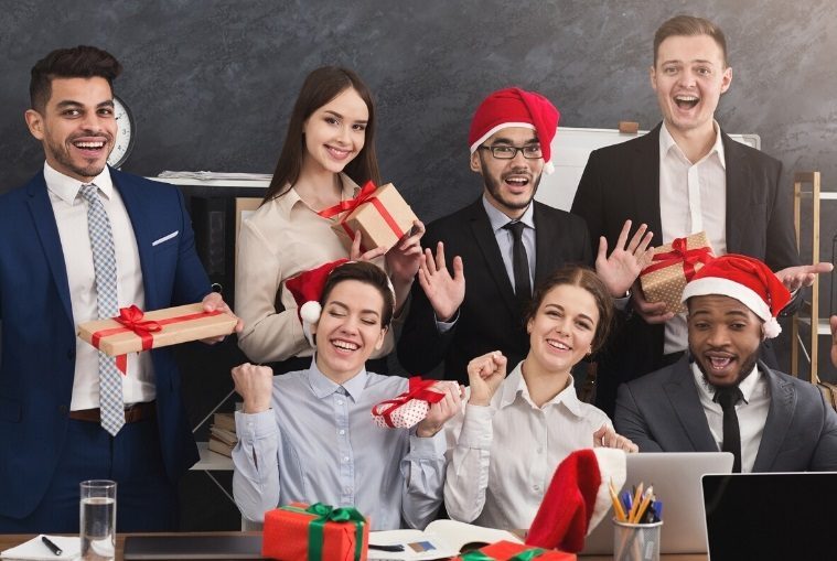 Group of people celebrating a sober Christmas with gifts and smiles