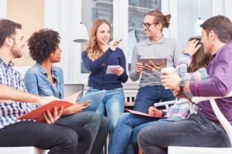 Diverse group discussing alcohol rehab strategies in a meeting