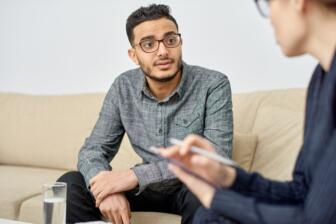 Man in therapy session discussing alcohol recovery program