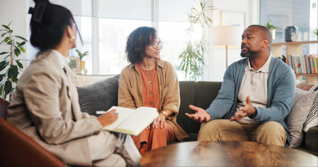 Couple meeting with a drug rehab counsellor in inpatient centre