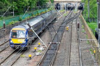 Train approaching tunnel on railway symbolizes path to Alcohol Rehab