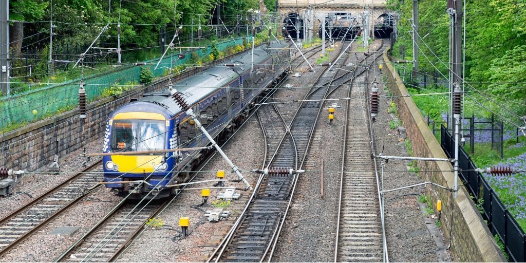 Train approaching tunnel on railway symbolizes path to Alcohol Rehab