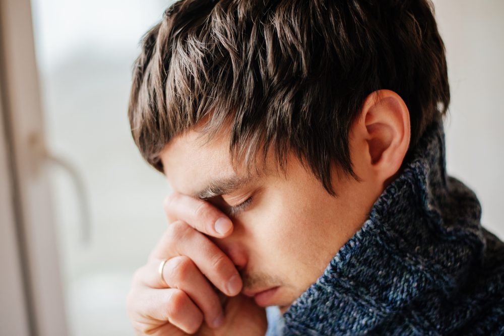 Man deep in thought, contemplating alcohol rehab programs