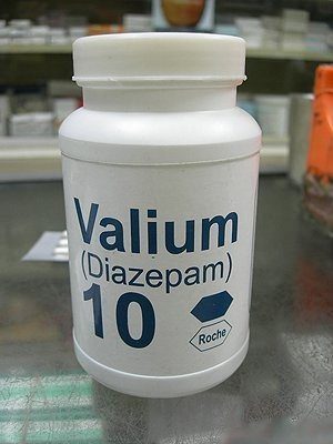 A bottle of Valium (diazepam 10 mg) is placed on a counter, clearly labelled and visible.